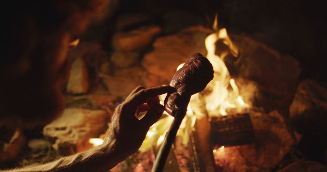 Person Cooking Meat on a Campfire in Wilderness - Free Images, Stock Photos and Pictures on Pikwizard.com