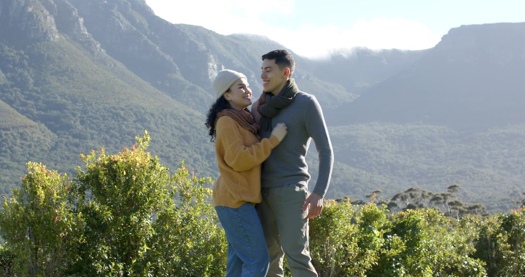 Couple Embracing in Scenic Mountain Valley