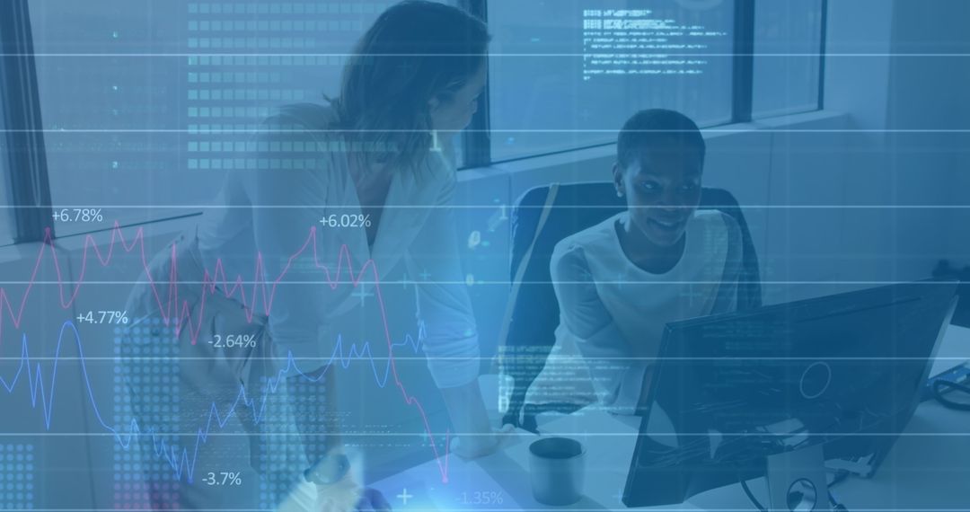 Diverse Business Team Analyzing Financial Data on Computer Screens