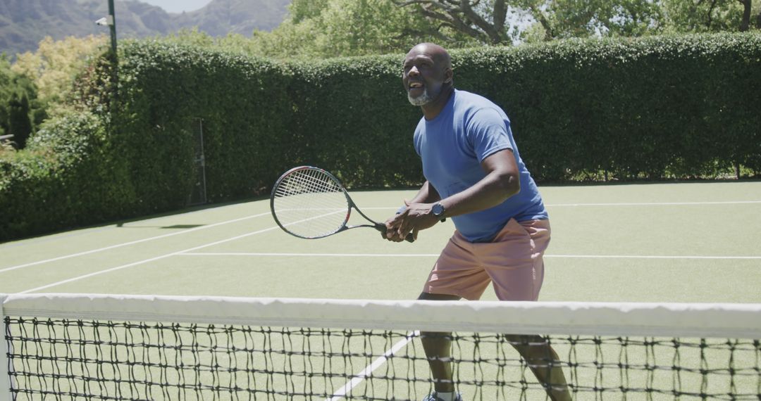 Senior Man Playing Tennis on Outdoor Court in Summertime - Free Images, Stock Photos and Pictures on Pikwizard.com