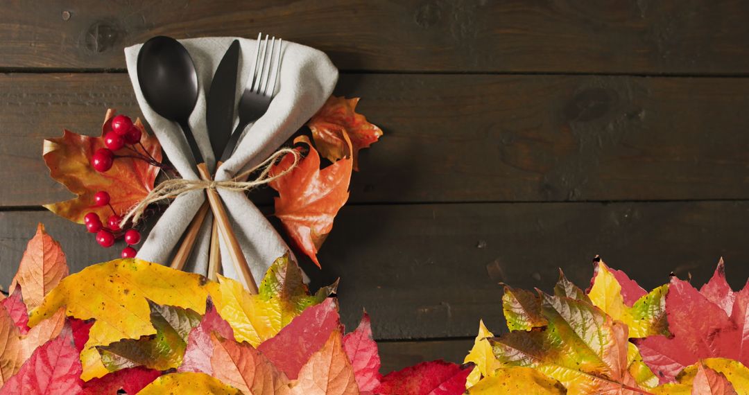 Autumn Thanksgiving Table Setting with Colorful Leaves