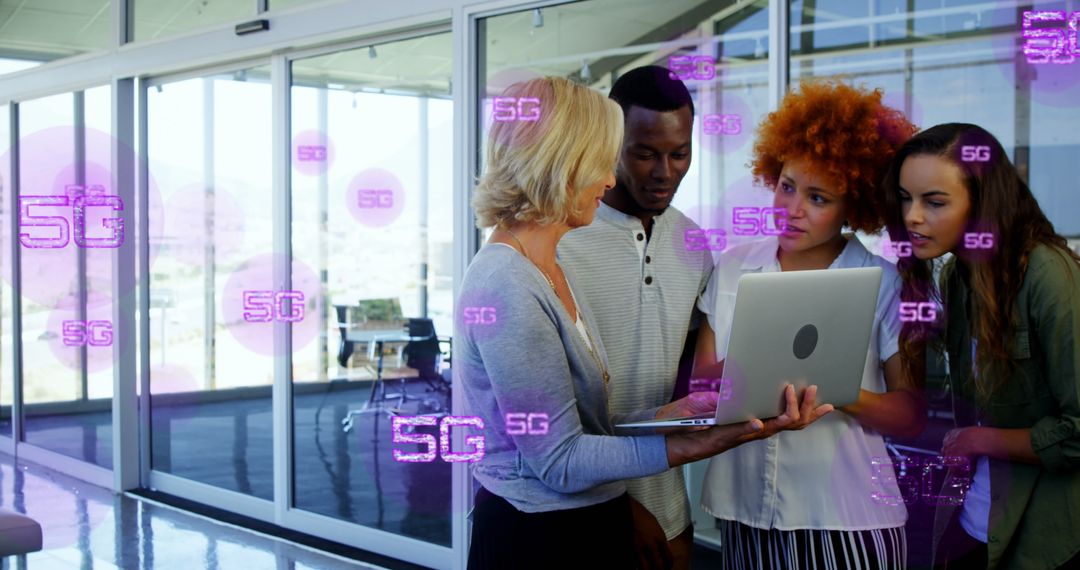 Diverse Team Collaborating on 5G Technology in Modern Office