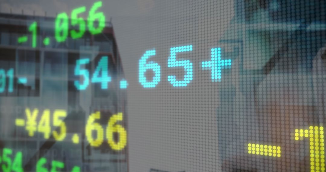 Stock Market Data Projection Over Modern High-Rise Buildings