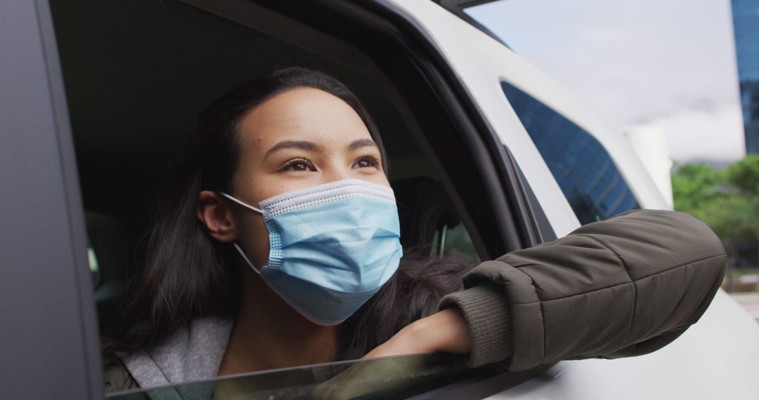 Young Woman Wearing Face Mask on Car Trip - Free Images, Stock Photos and Pictures on Pikwizard.com