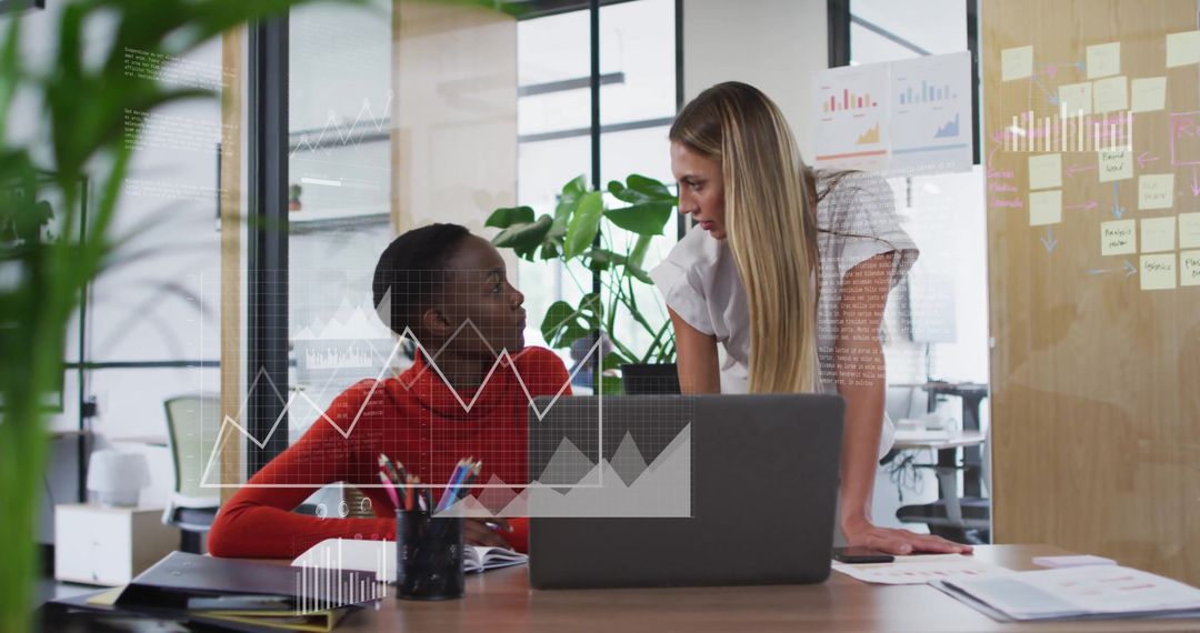 Diverse Colleagues Analyzing Data Visualizations in Modern Office