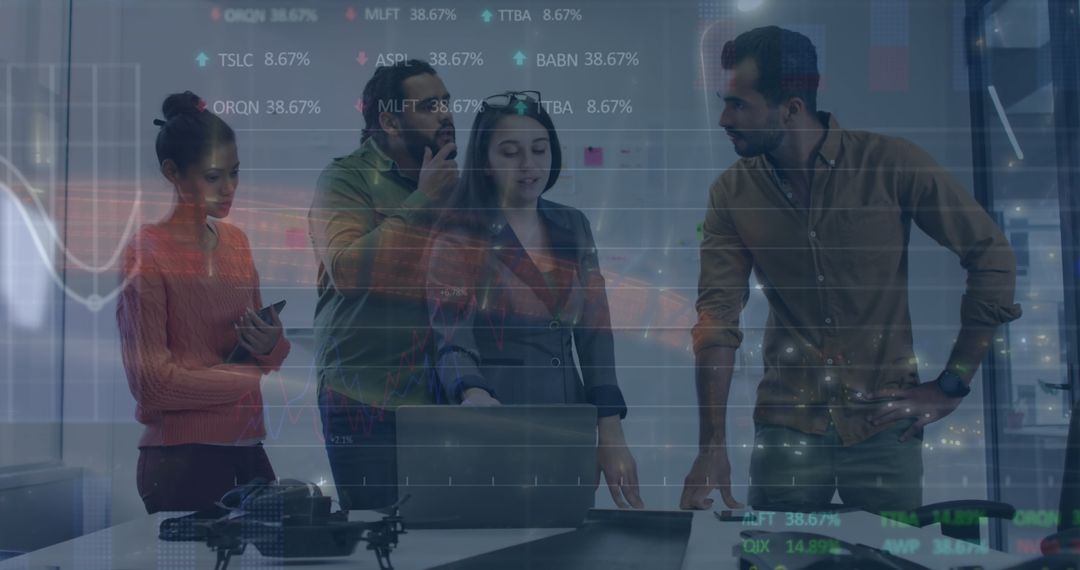 Team Analyzing Data with Digital Interface in Meeting Room