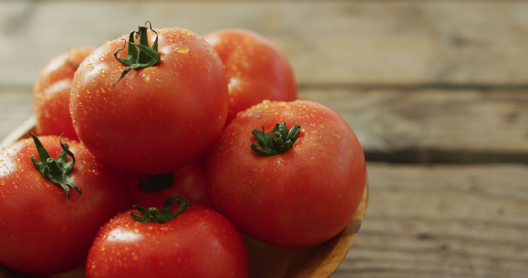 Image of close up of fresh tomatoes in bowl over wooden background - Free Images, Stock Photos and Pictures on Pikwizard.com