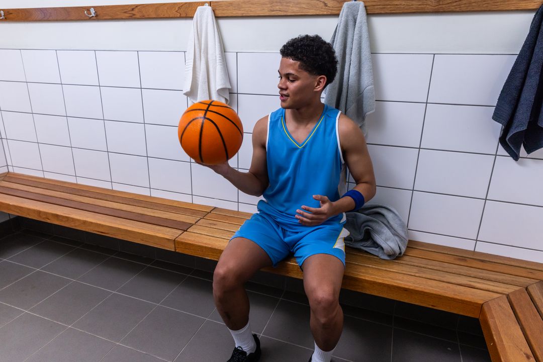 Young Basketball Player Contemplating in Locker Room