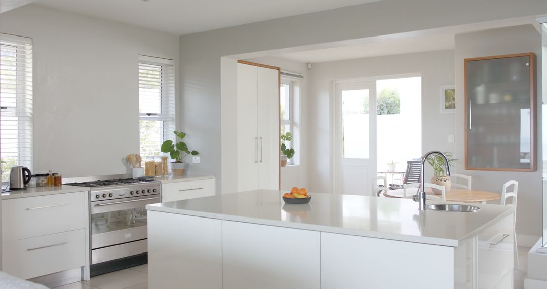 Modern Minimalist Kitchen with Island and White Cabinets - Free Images, Stock Photos and Pictures on Pikwizard.com