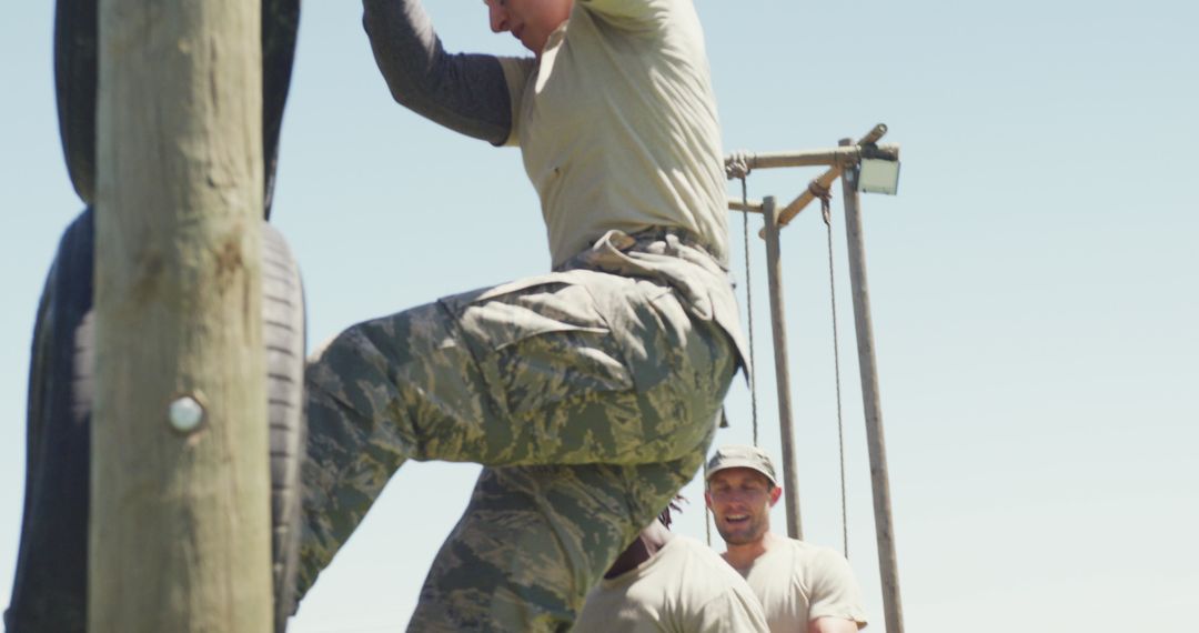 Female Soldier Navigating Army Obstacle Course on Sunny Day