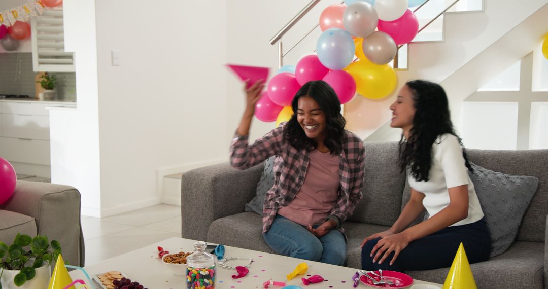 Cheerful Celebration with Friends in Festive Living Room