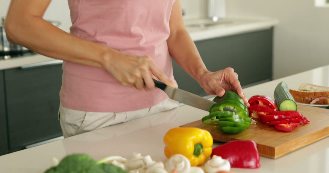 Person Cutting Bell Peppers in Modern Kitchen - Free Images, Stock Photos and Pictures on Pikwizard.com