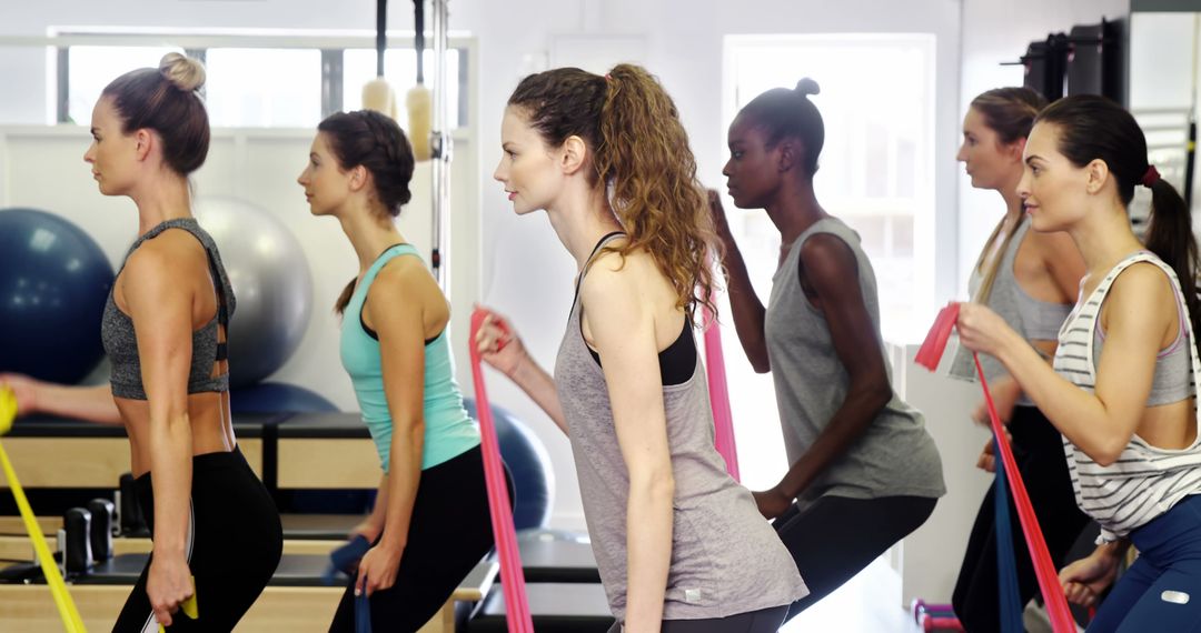 Women Using Resistance Bands in Group Fitness Class - Free Images, Stock Photos and Pictures on Pikwizard.com