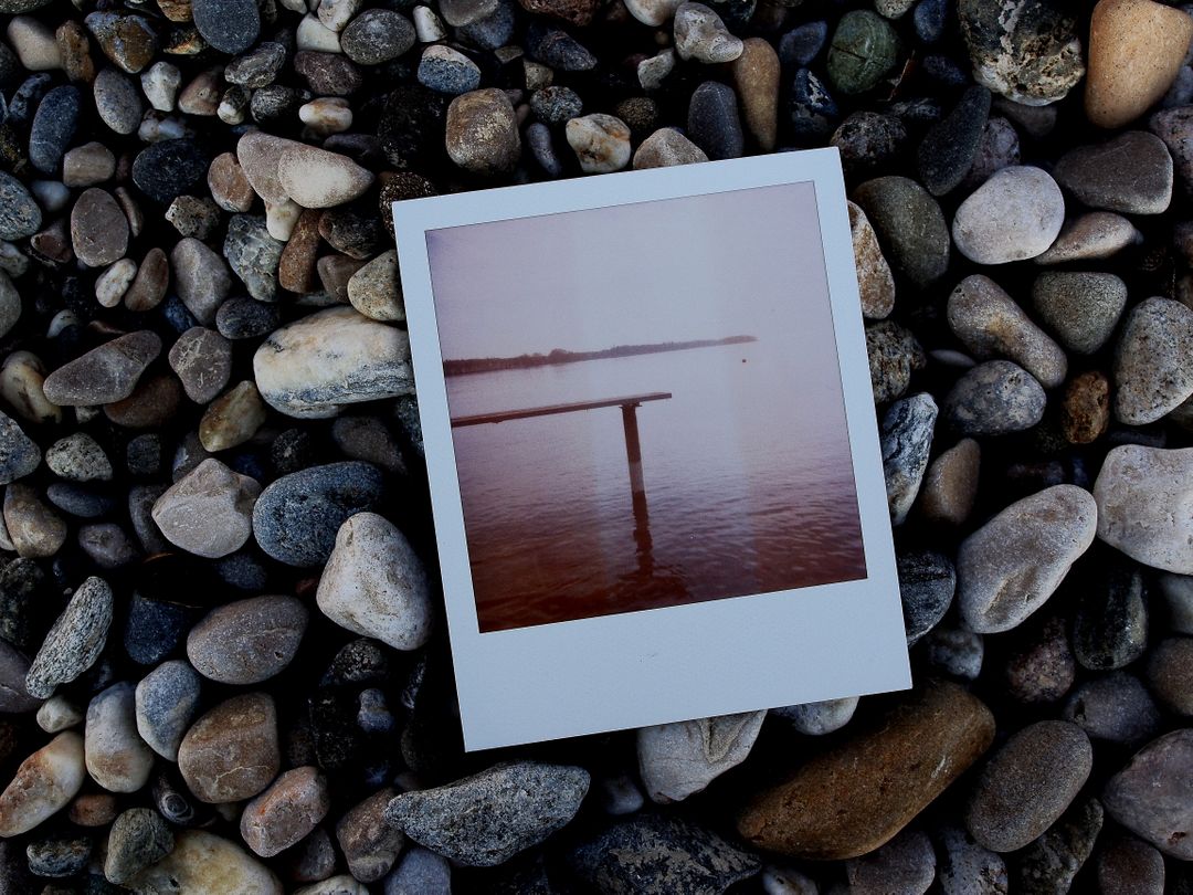 Vintage Polaroid Photo of Dock on Rocky Beach - Free Images, Stock Photos and Pictures on Pikwizard.com