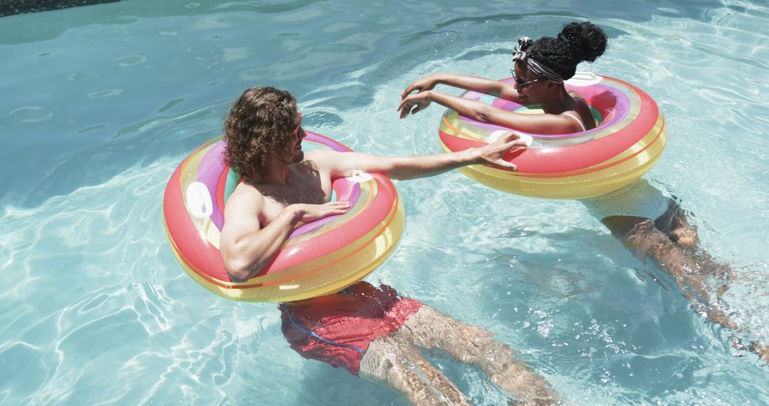 Relaxing Couple Enjoying Floating on Summer Day