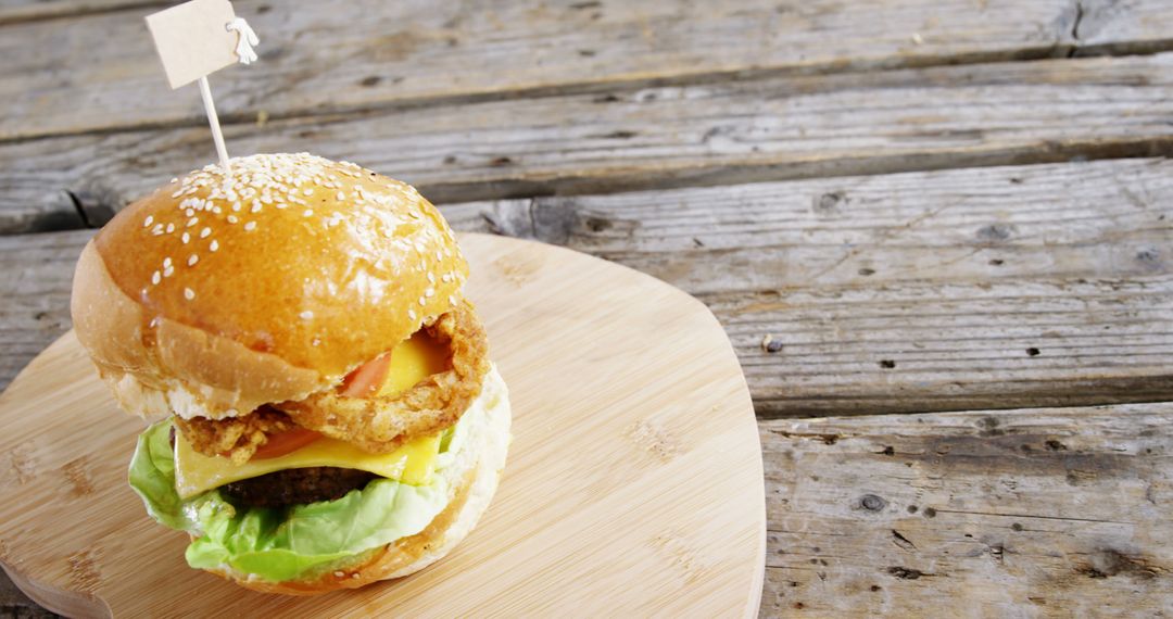 Delicious Cheeseburger with Crispy Onion Rings - Free Images, Stock Photos and Pictures on Pikwizard.com