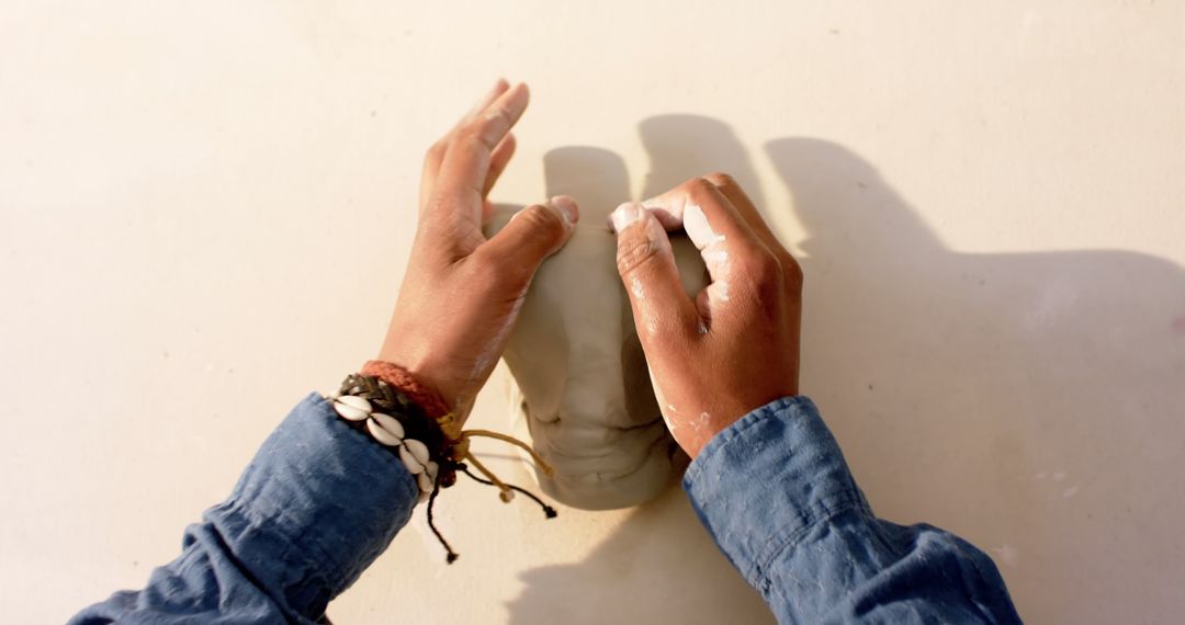 Hands Sculpting Clay Pot on Table - Free Images, Stock Photos and Pictures on Pikwizard.com