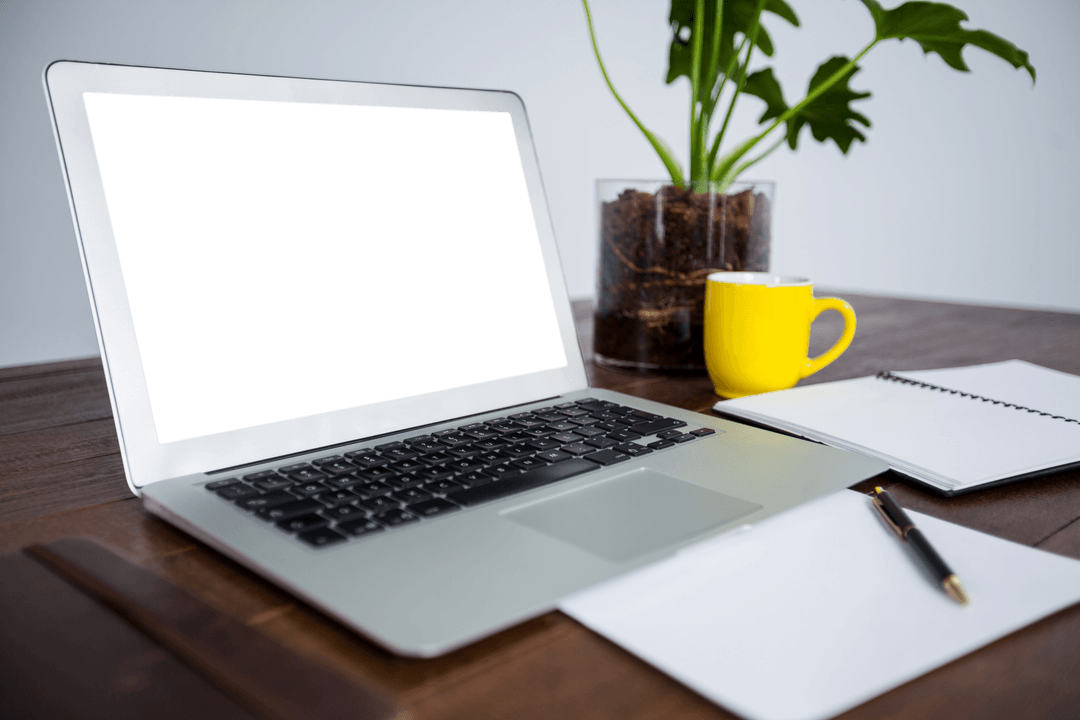 Office desk setup with transparent laptop screen and documents
