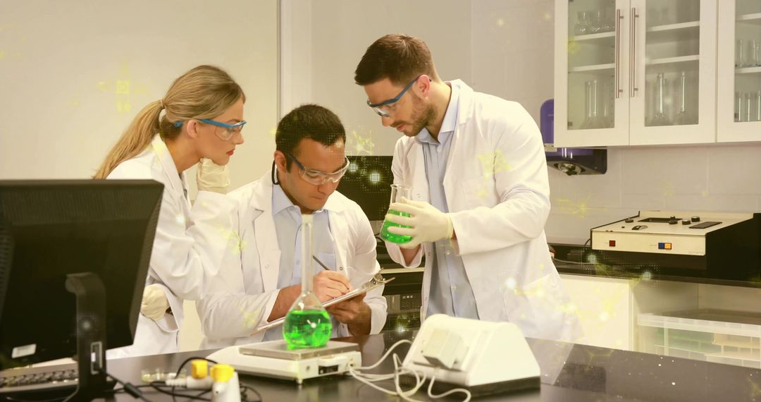 Chemists Analyzing Solutions Recording Data in Laboratory Setting