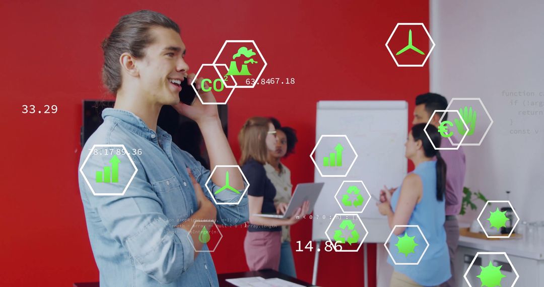 Smiling Professional on Phone During Team Meeting with Data Visualization