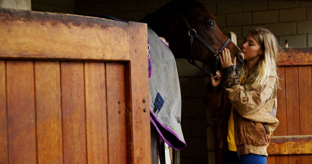 Young Woman Showing Affection to Horse in Stable - Free Images, Stock Photos and Pictures on Pikwizard.com