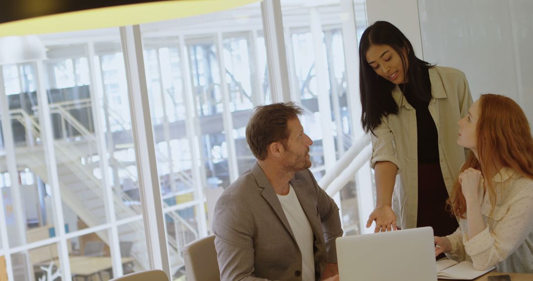 Colleagues Engaging in Collaborative Office Discussion at Work
