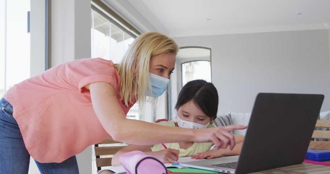 Mother Helping Daughter with Online Learning at Home During Pandemic - Free Images, Stock Photos and Pictures on Pikwizard.com