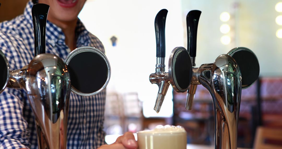 Bartender Pouring Fresh Draft Beer in Lively Bar Atmosphere