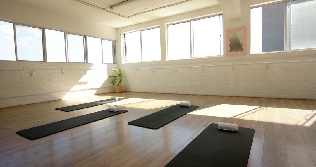 Sun-Filled Yoga Studio Ready with Mats and Blocks
