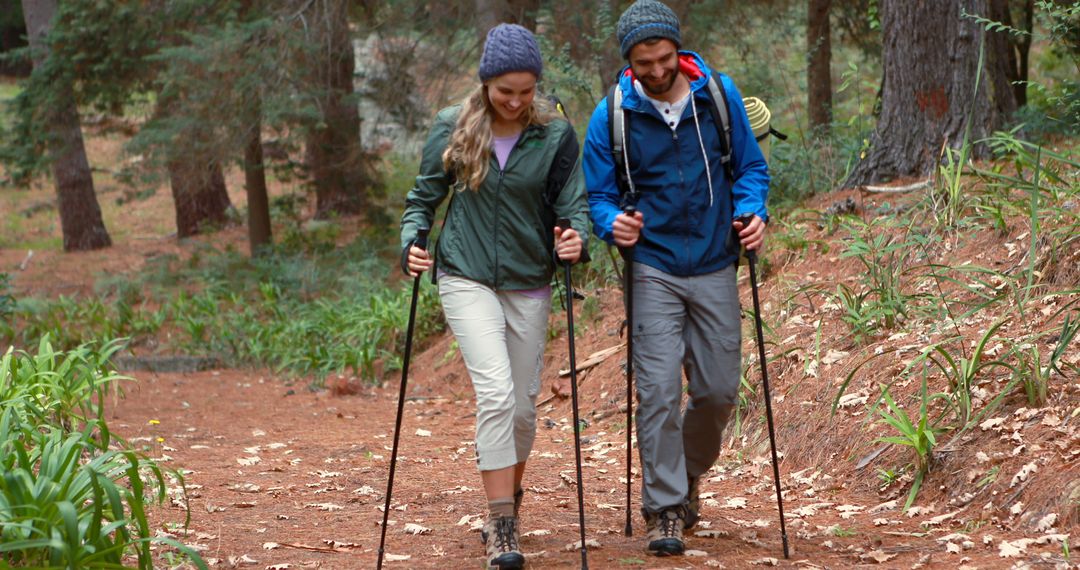 Hiker couple hiking in forest at countryside - Free Images, Stock Photos and Pictures on Pikwizard.com