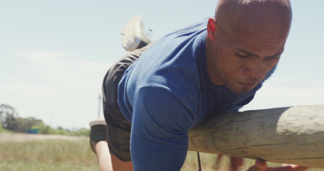 Man Conquering Obstacle Course in Outdoor Training