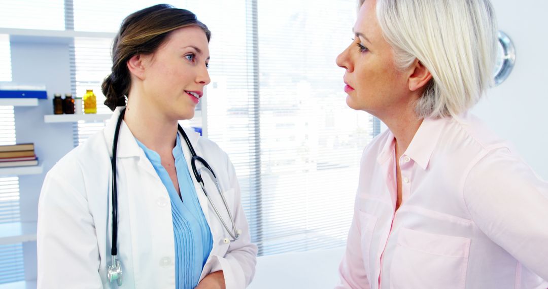 Female Doctor Consulting Mature Woman in Medical Office - Free Images, Stock Photos and Pictures on Pikwizard.com