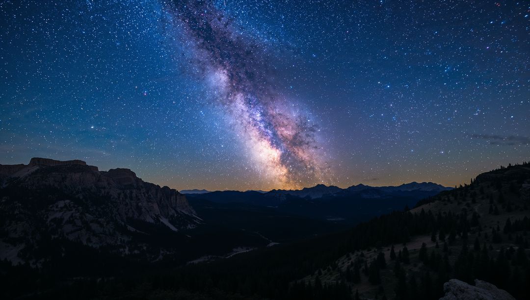 Glowing Milky Way Rising Over Alpine Mountain Ridges at Night with Galactic Core, Star Field