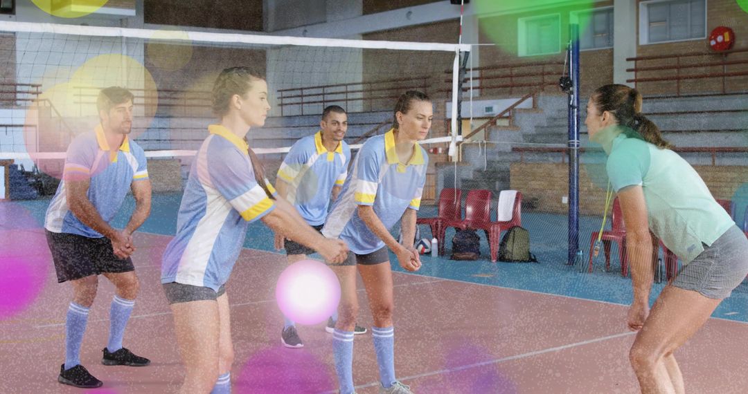Volleyball Team Preparing for Match in Gym