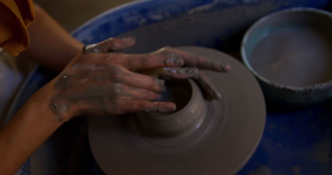 Hands Sculpting Pottery on Pottery Wheel - Free Images, Stock Photos and Pictures on Pikwizard.com