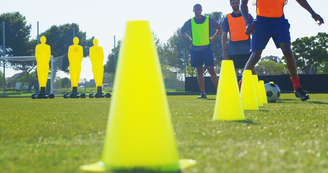 Soccer Training Session with Bright Cones and Dummy Figures - Free Images, Stock Photos and Pictures on Pikwizard.com