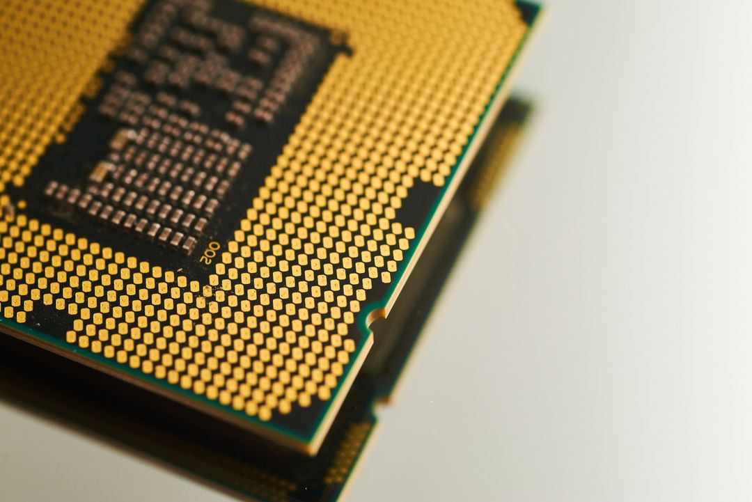 Close-up View of Gold-Plated Computer Processor on White Background