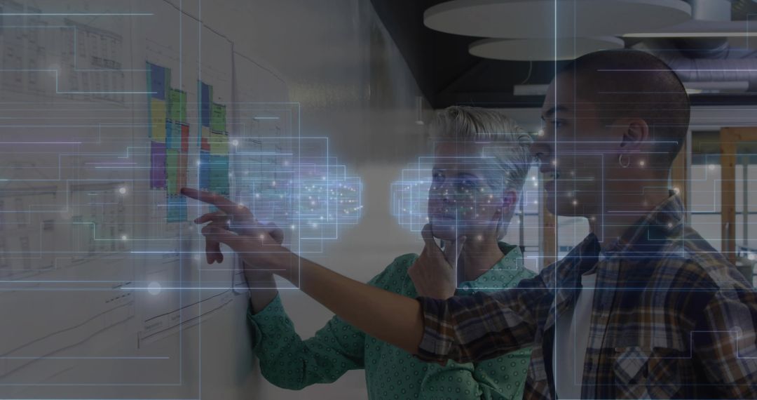 Collaborative Teamwork in Modern Office with Digital Graphics