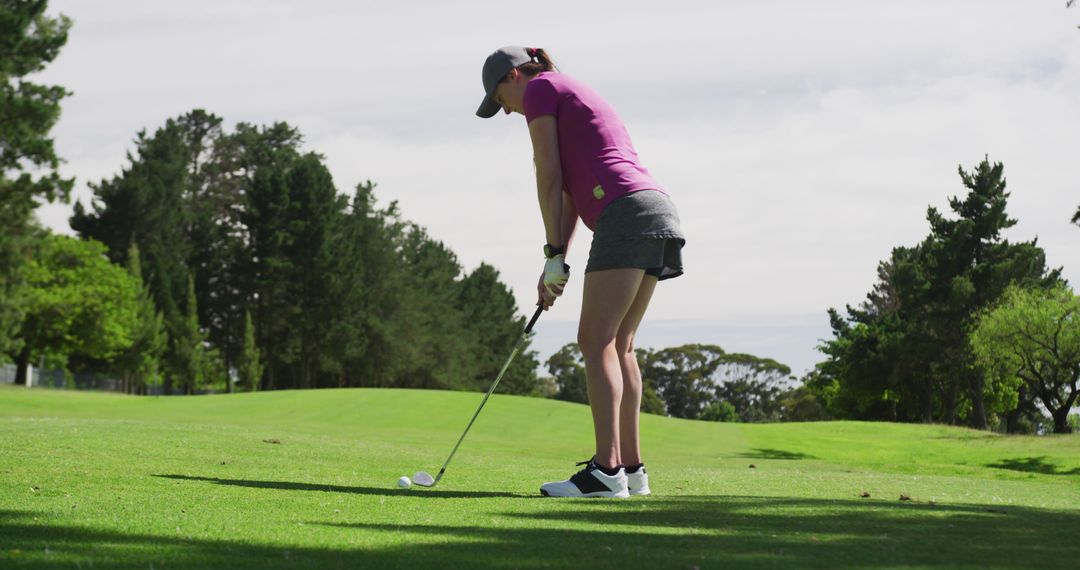 Female Golfer Concentrating During Pre-Swing on Sunny Day - Free Images, Stock Photos and Pictures on Pikwizard.com