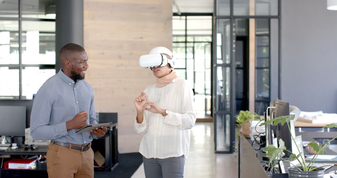 Businesswoman Using VR Headset While Collaborating in Modern Office