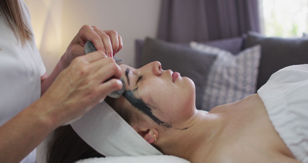 Woman Receiving Facial Treatment at Modern Skincare Clinic - Free Images, Stock Photos and Pictures on Pikwizard.com