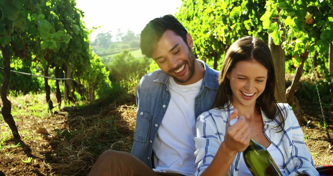 Couple Enjoying Leisurely Day in Vineyard Amidst Lush Greenery