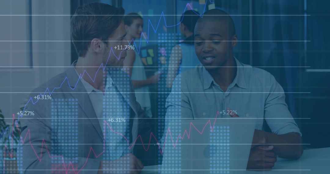 Business Professionals Engaged in Data Analysis Discussion