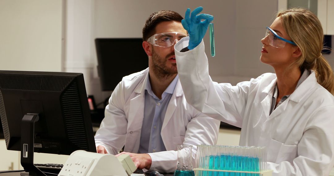 Scientists Working with Test Tubes in Laboratory - Free Images, Stock Photos and Pictures on Pikwizard.com