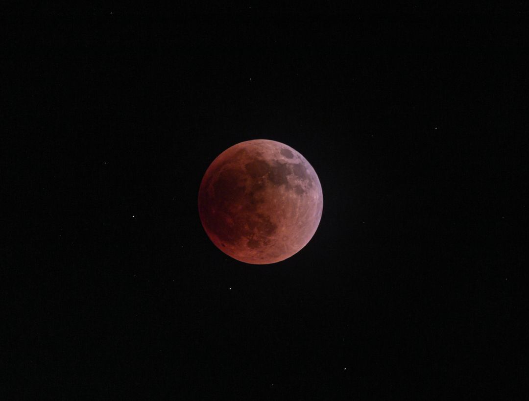 Stunning Lunar Eclipse with Blood Moon in Night Sky