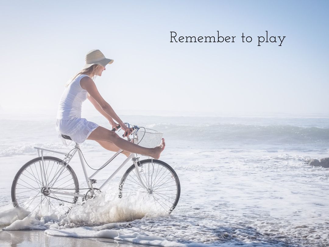 Woman Cycling Along Beach as Waves Crash Promotes Freedom