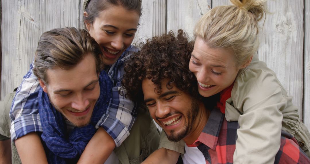 Group of Friends Hugging and Laughing Outdoors - Free Images, Stock Photos and Pictures on Pikwizard.com