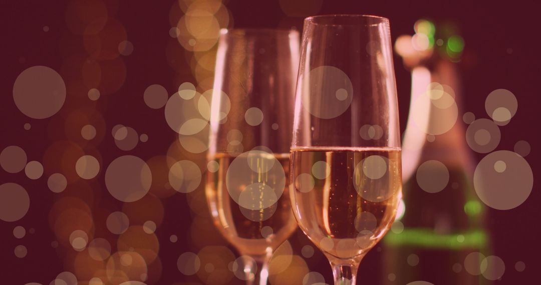 Champagne Glasses with Bokeh Lights Celebrating Festivities