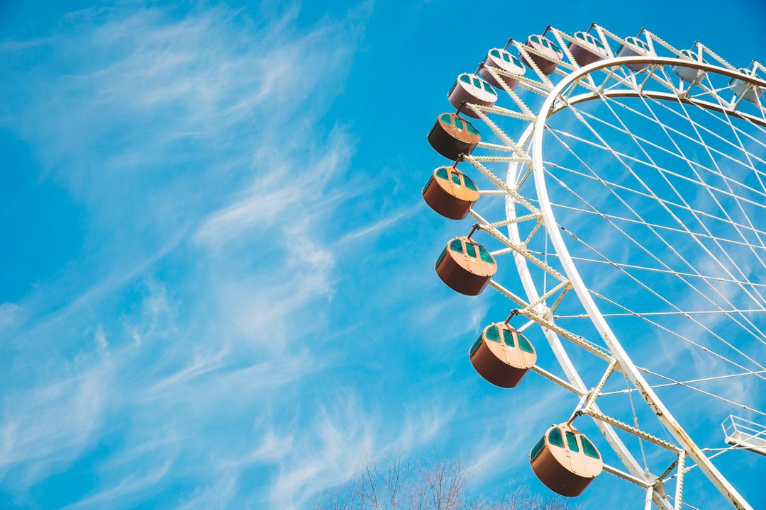 Cloudy Blue Sky over Ferris Wheel - Free Images, Stock Photos and Pictures on Pikwizard.com
