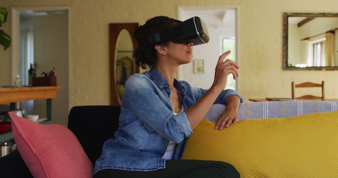 Woman Using Virtual Reality Headset at Home in Relaxed Setting - Free Images, Stock Photos and Pictures on Pikwizard.com